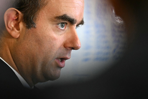 France's newly re-appointed prime minister names new Cabinet in bid to quell political turmoil