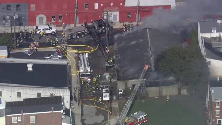 Firefighters battle fire at truck repair shop in Bridgeport, Pa.