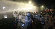 Georgia's police use water cannons to push back protesters