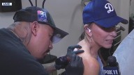FOX 11 reporter gets Dodger tattoo live on air