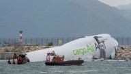 Emirates cargo plane crash lands into sea at Hong Kong International Airport, killing two people and closing major runway