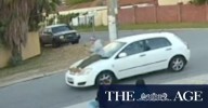 Passenger caught on camera riding on car bonnet