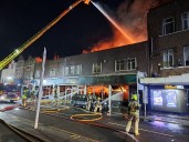 Huge fire above south east London shop sends smoke billowing into the sky