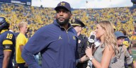 Michigan and coach Moore drop appeal of NCAA penalties from sign