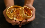 Gold prices touch new highs on weak dollar, fiscal worries, central banks buying: Report