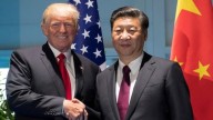 US market opens significantly lower amid US-China trade tensions and mixed bank results
