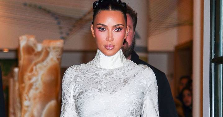 Photos: Kim Kardashian 'Looks Chic' in White Lace Dress Look