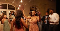Bridesmaid walks down aisle with dapper man in suit, then people realise who it is