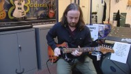 Gig Harbor guitar shop owner battles credit card scam
