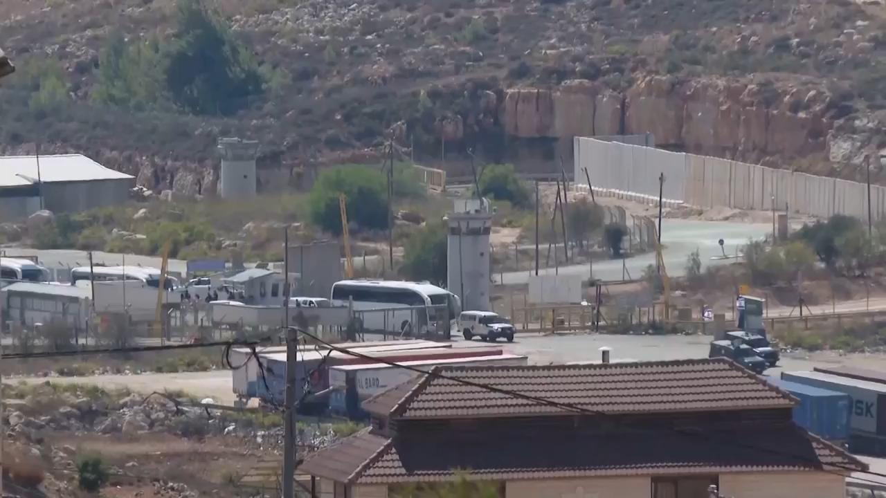 Buses thought to be carrying released Palestinian prisoners leave West Bank's Ofer prison