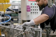 UK business activity improves as manufacturing returns to growth