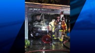 Firefighters battle garage fire in Warwick
