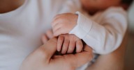 Parenting expert explains why you should never kiss baby on the face or hands