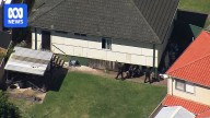 Tactical police attend property in Panania.