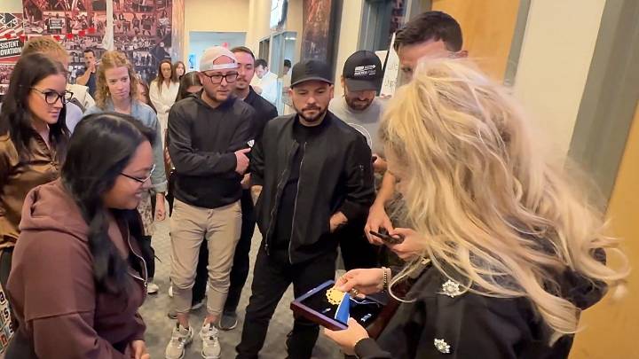 Erika Kirk shows Charlie Kirk's Medal of Freedom to Turning Point staff