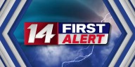 Lingering showers and storms this morning and breezy