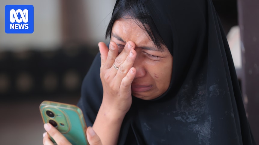 Five people pulled alive from site of Indonesia school collapse as rescuers race against time to find others