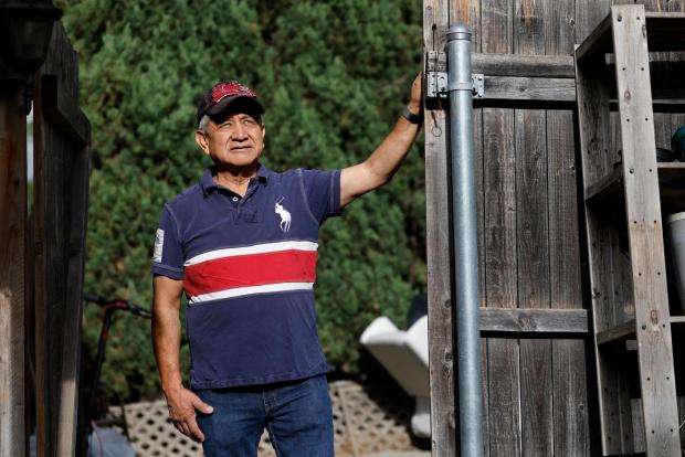 In the fire zones, an immigrant workforce warily carries out cleanups