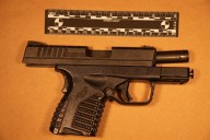 Liquor shop owner arrested after cops find cocaine and loaded pistols