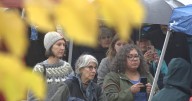 Faith leaders hold a vigil in the wake of the raid in Wilder
