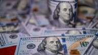 Dollar claws back losses from U.S. government shutdown, turns slightly higher