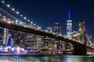 Why has N.Y. Gov. Hochul announced landmarks will be lit in blue and green on Tuesday?