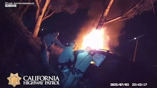 Video shows California Highway Patrol officers rescue unconscious driver from burning car in Gardena