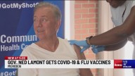 Lamont gets vaccinated for COVID, flu, says state is lagging behind