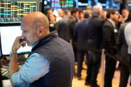Wall Street sets more records, but bond yields drop following discouraging data on the job market