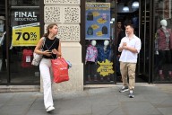 UK shop prices fall for first time since March, retailers say