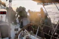 Israeli navy intercepts some flotilla boats but others are nearing the coast of Gaza, activists say