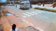 Video: Minibus hits divider, overturns while trying to avoid woman crossing road