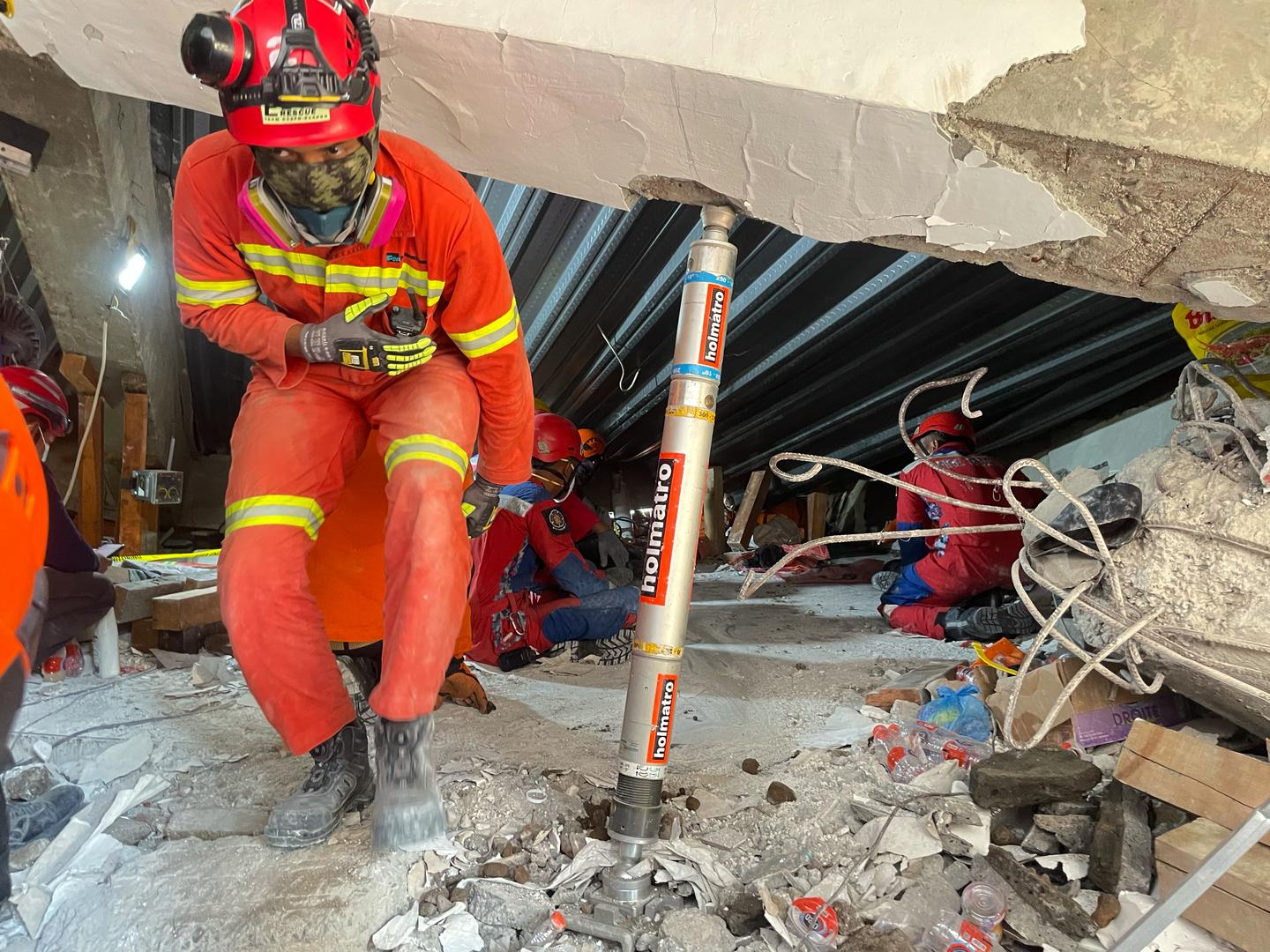 Rescuers search for students who remain buried in rubble 2 days after school collapse in Indonesia