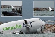 Cargo plane skids off runway into sea in Hong Kong