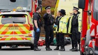 Four injured in car and knife attack outside UK synagogue; suspect shot