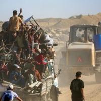 Palestinians return to devastated Gaza City as truce holds