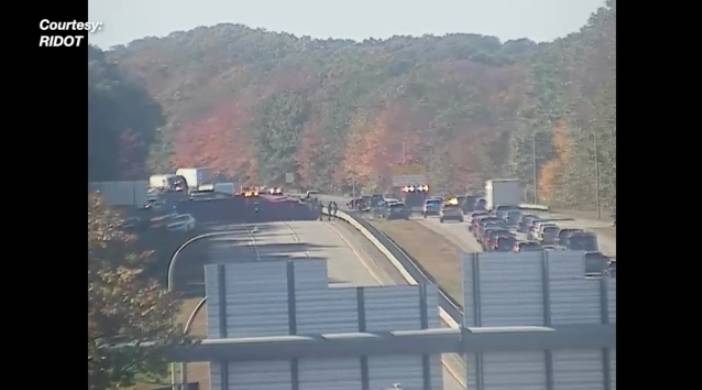 East Greenwich tractor trailer rollover crash spills gravel on highway, five drivers treated for injuries