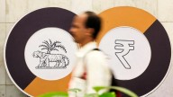 Rupee gains 25 paise on RBI intervention