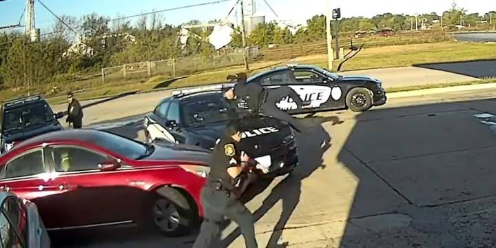 Officer thrown onto hood of car by suspect who soon crashed into lake, police say