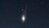 When is a 'double fireball' not a 'double fireball'? Wild meteor videos explained by a trick of the light