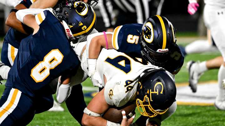 With 2020 group as inspiration, DeWitt football thriving on defense