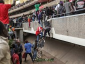 Police in Kenya fire tear gas to disperse mourners at Raila Odinga viewing