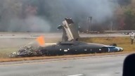 Plane crashes on Massachusetts highway in heavy rain, killing 2 and injuring 1