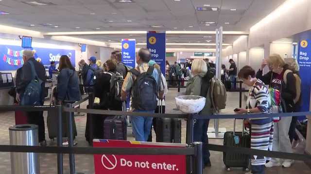 Airport travelers share concerns as they experience delays