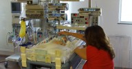 National swimmer Ashby Edmonds returns to Bristol hospital where medics saved his life as a baby