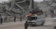 The Latest: Palestinians journey back home as aid convoys start to enter Gaza