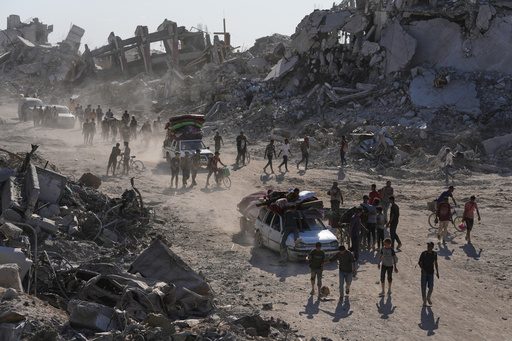 Some Palestinians pack up and move north toward their homes in Gaza after ceasefire goes into effect