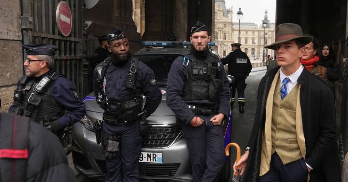 'Unusually well-dressed' man in fedora at Louvre heist scene sparks wild internet theories