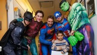 Bruins dress up as superheroes, visit young patients at local hospitals