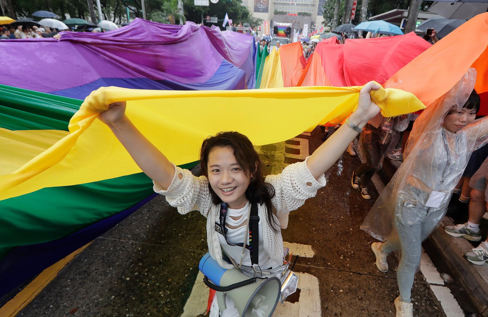 Taiwan LGBTQ+ Pride participants express disagreement on US President's gender binarism